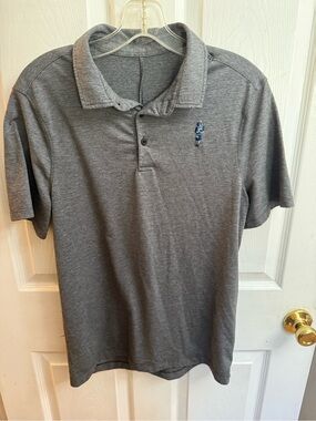 Lululemon golf polo shirt with Scottish bagpipe logo